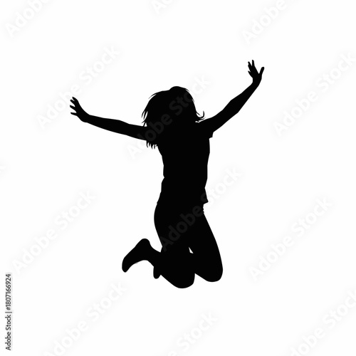 Silhouette of a joyful woman leaping into the air with arms raised in celebration.