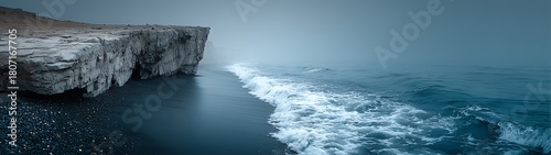 Aerial Wide Angle View of Endless Cliff with Black Sand Beach and White Rock, Calm Blue Waves under Mysterious Grey Sky, Hyper-Realistic Natural Landscape.
