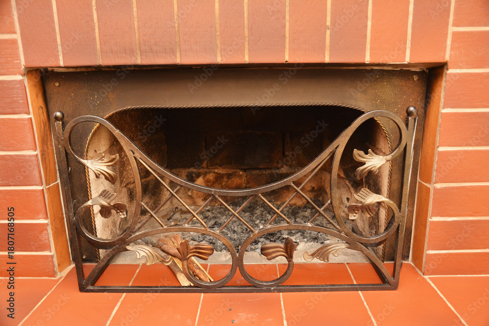 Naklejka premium Decorative Metal Fireplace Screen in Brick Hearth