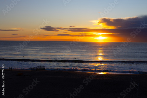 Golden sunset over the Pacific Ocean at Redondo Beach, reflecting on the water.