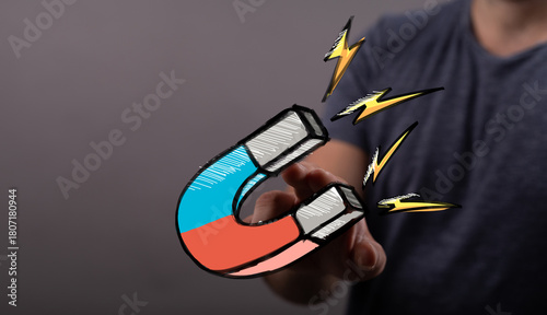 Hand holding digital magnet...