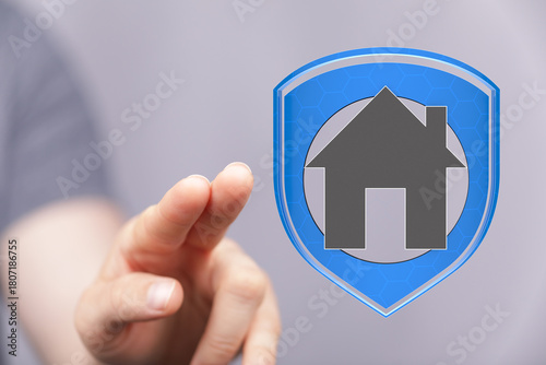Hand pointing at a house ic...