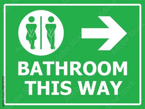 Green toilet sign with directional arrows and Bathroom This Way