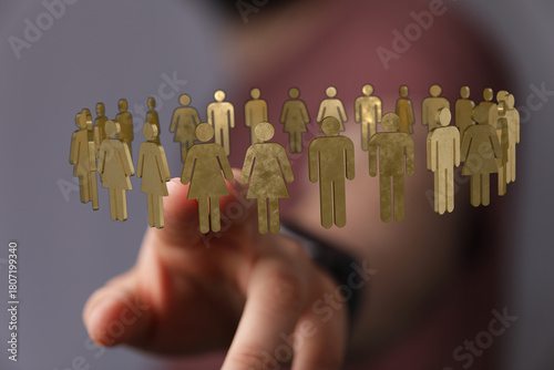 Hand pointing at a group of...