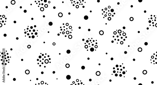 A seamless black and white abstract pattern featuring scattered dots and clusters of small circles with larger rings, creating a modern geometric design.
