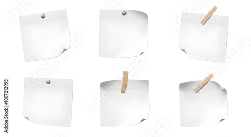 Collection of six white sticky notes attached with pins and clips on a black background