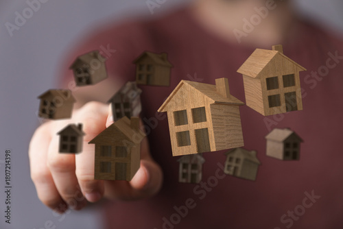 A hand holding miniature wo...