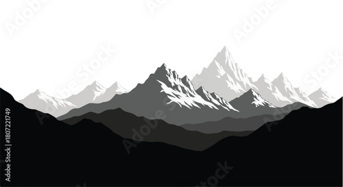 Majestic snow-capped mountain range stretching across a vast, serene landscape under a bright sky.