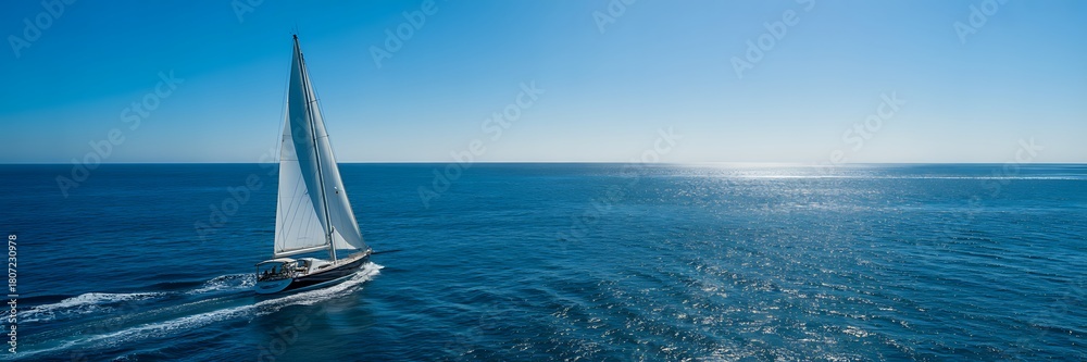 Fototapeta premium Aerial View Of White Sailing Yacht On Deep Blue Ocean