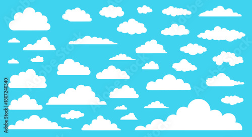 Beautiful fluffy white clouds against a clear blue sky for dreamy designs and calming backgrounds