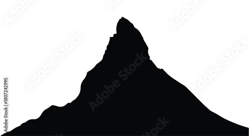 Dramatic silhouette of a jagged mountain peak against a white background.
