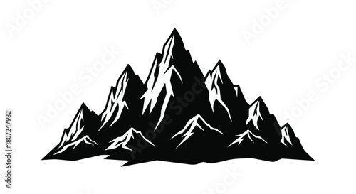 Majestic, jagged mountain peaks reaching towards the sky in a dramatic silhouette.