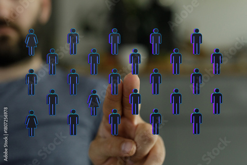 Hand pointing at human figu...
