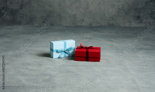 Christmas teal and red present on a A high-resolution textured gray studio backdrop with subtle gradients and painterly details. Ideal for portrait photography, product shoots