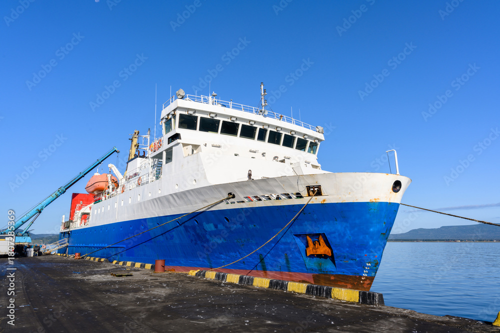 Naklejka premium Large research vessel docked in Yuzhno-Kurilsk