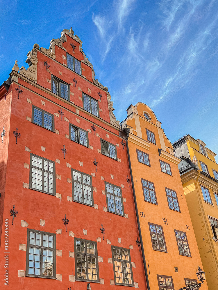 Fototapeta premium red and yellow buildings on central Stockholm square famous for markets and often seen on postcards