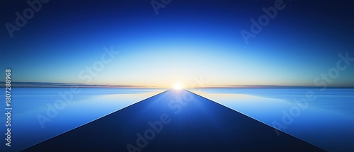 A straight line leads to the horizon under a blue sky with calm water and a rising sun casting light, symbolizing hope for new beginnings