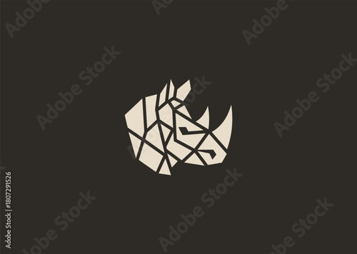 A strong geometric rhinoceros logo formed with sharp polygonal contours and structured line blocks, symbolizing power, protection, and resilience in a clean minimalist vector style