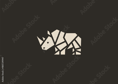 A strong geometric rhinoceros logo formed with sharp polygonal contours and structured line blocks, symbolizing power, protection, and resilience in a clean minimalist vector style