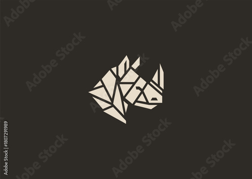A strong geometric rhinoceros logo formed with sharp polygonal contours and structured line blocks, symbolizing power, protection, and resilience in a clean minimalist vector style