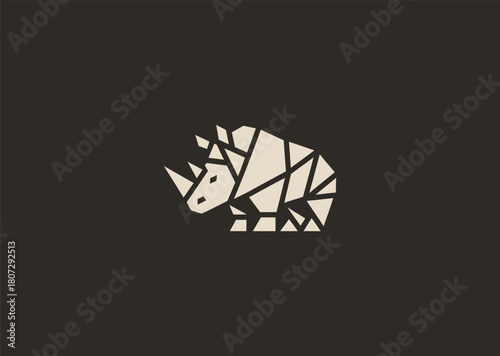 A strong geometric rhinoceros logo formed with sharp polygonal contours and structured line blocks, symbolizing power, protection, and resilience in a clean minimalist vector style