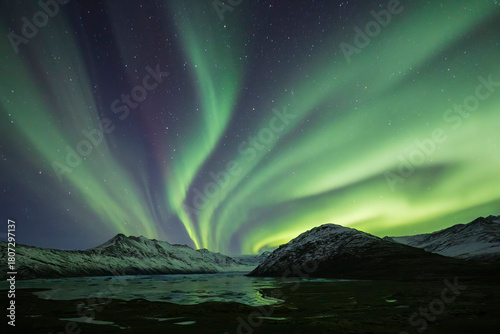 Aurora Borealis, the natural light display in the sky caused by charged particles from the sun colliding with gases in Earth's atmosphere, northern lights.