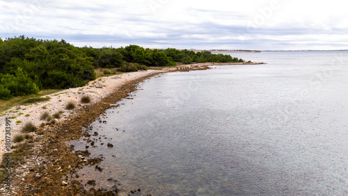 Fototapeta Naklejka Na Ścianę i Meble -  Remote Croatian Beaches Accessible Only by Off-Road Vehicles. Rugged coastline, untouched nature, wild Mediterranean landscapes and secluded turquoise shores captured from above