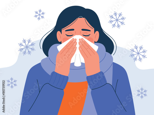 A person blows their nose with a tissue while surrounded by snowflakes.