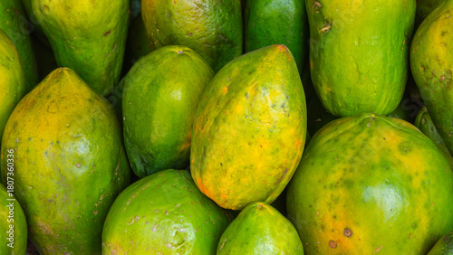 Ripe and Juicy Yellow Pawpaws at a Kenyan Market Stall

Ripe, juicy yellow pawpaws displayed at a busy Kenyan market stall, highlighting fresh tropical fruit and vibrant local produce