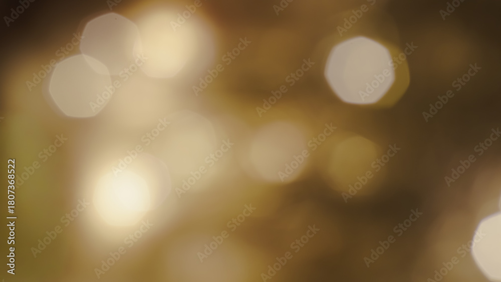 Obraz premium Soft shimmering golden shapes create a warm atmospheric Christmas light scene.