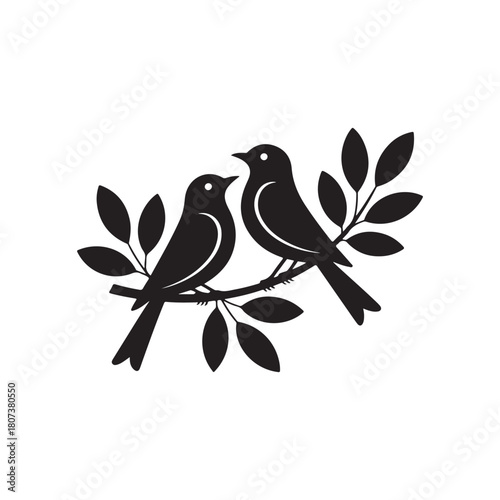 Two black birds perched on a branch with leaves silhouette leaf nature