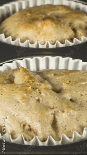 Banana nut muffins cooking close up time lapse.  Vertical video.