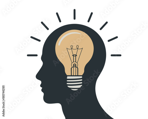 A silhouette of a head with a bright lightbulb symbolizing a new idea or concept inside.
