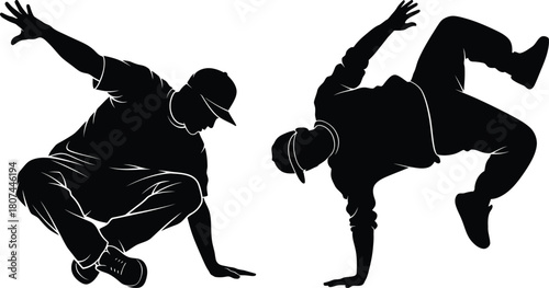 Silhouette of Breakdancers Performing Hip Hop Dance Moves