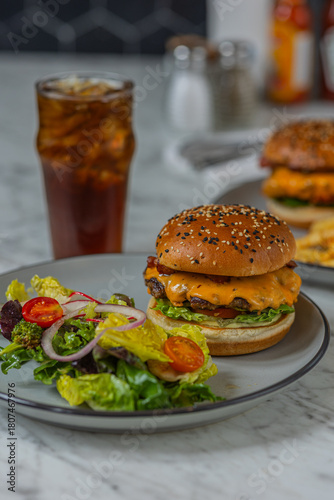 bacon cheeseburger on sesame seed bun in diner hard light