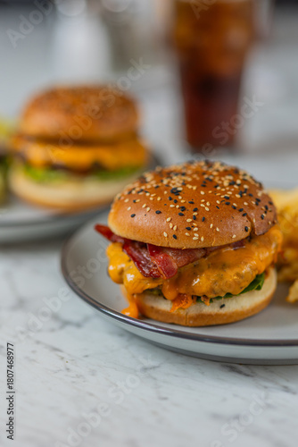 bacon cheeseburger on sesame seed bun in diner hard light