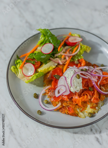 smoked salmon rosti with fried egg in diner hard light