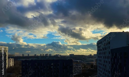 Intense sky scene highlighting storm and sunlight over cityscape