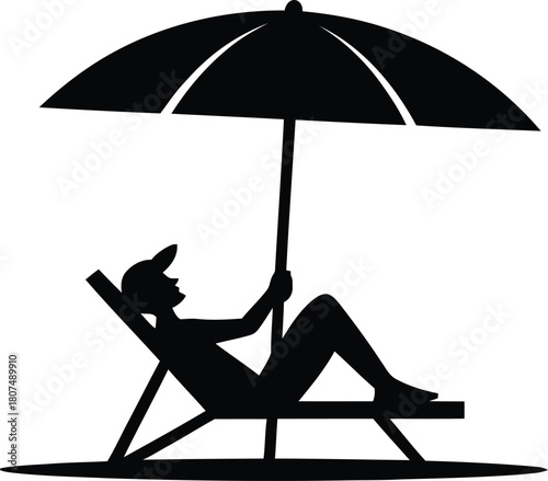 Relaxing person silhouette in lounge chair under beach umbrella.