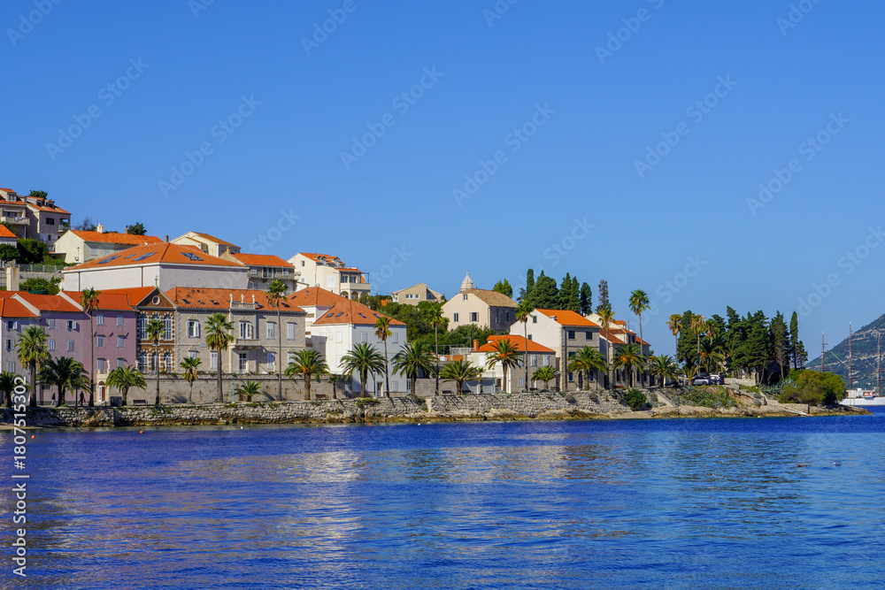 Obraz premium Seafront view at beautiful Korcula town in summertime, touristic place in Southern Croatia, Europe Mediterranean.