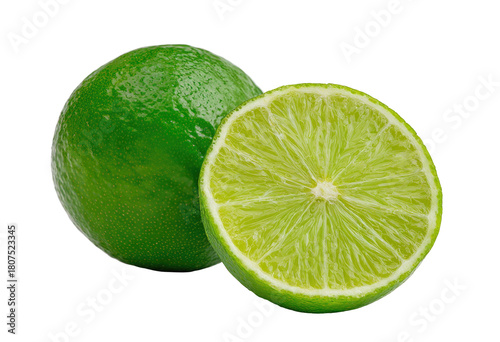 Two vibrant limes, one whole and one sliced in half,  displaying a bright, glossy green skin and juicy interior