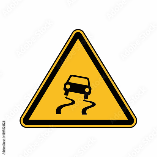 Slippery road sign in yellow warns of hazardous conditions, this slippery road sign indicates potential risks to drivers.