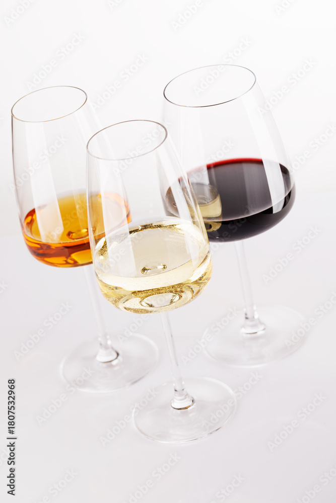 Obraz premium Different wine glasses on white background