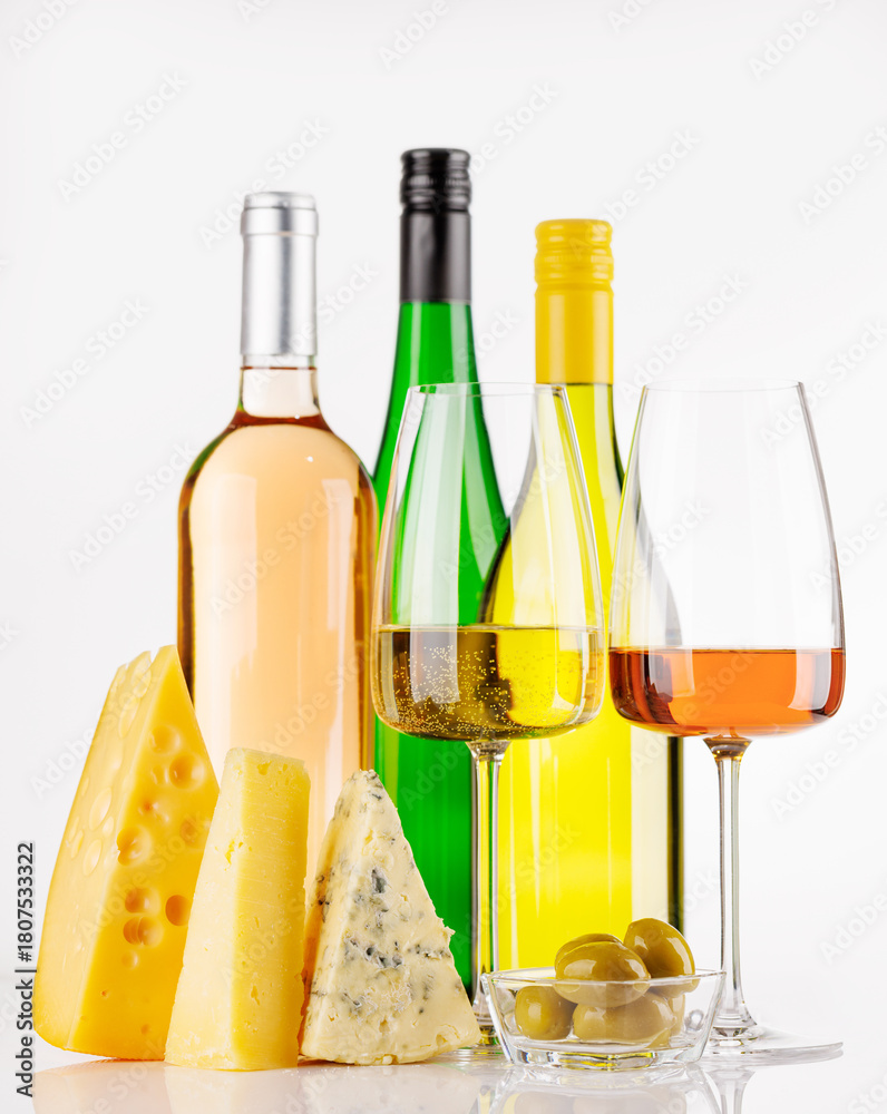 Naklejka premium Assorted cheeses and wine on white background