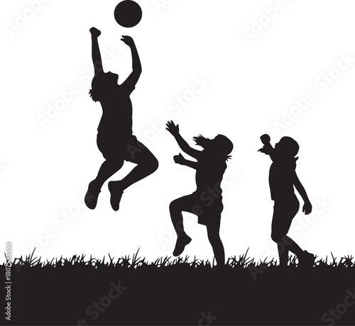 Silhouette of children playing with ball in field fun and carefree