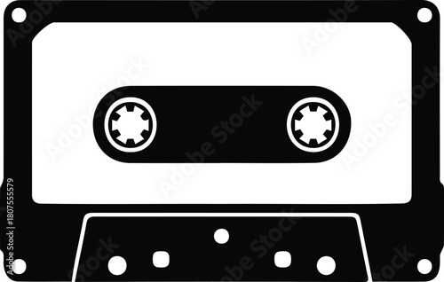 Black silhouette of a vintage audio cassette tape, a classic symbol of retro music, sound recording, and oldschool technology from the 80s and 90s era