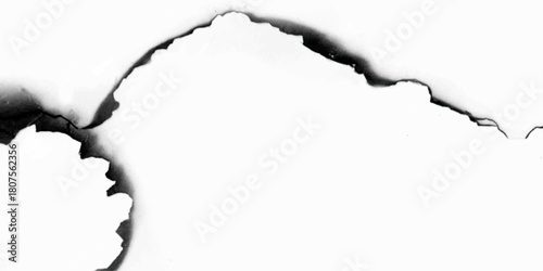 hole in a white paper. burnt holes in a paper. 