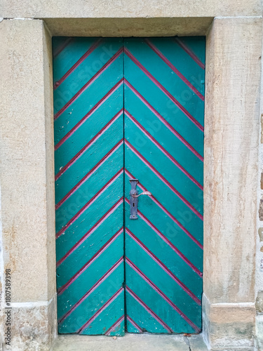 Old wooden door with colourful paint