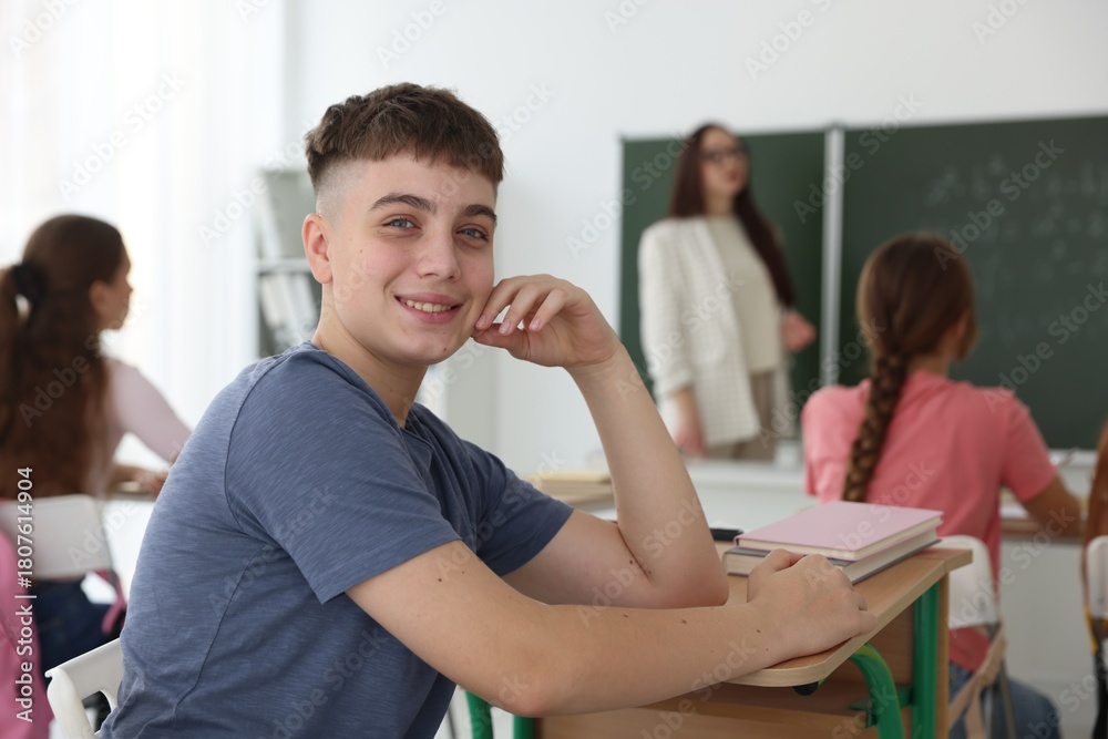 Obraz premium Teacher and students during lesson in classroom, selective focus