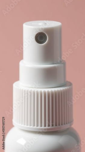 A close-up view of a bottle of transparent liquid with a label and cap